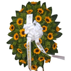 arreglo funebre con girasoles